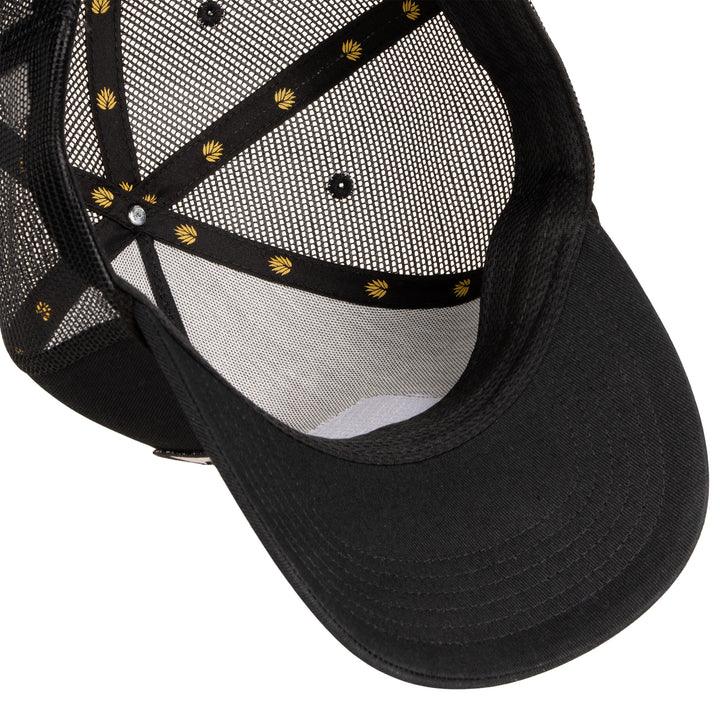 Black cap with mesh back and decorative elements on a white background
